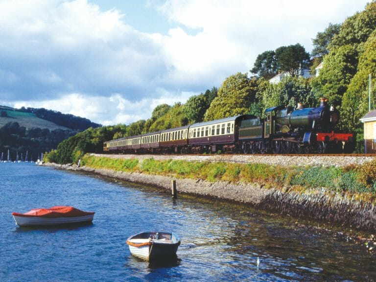 Steam train approaching Kingswear. Devon. England